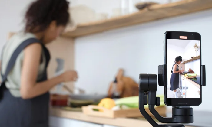Smartphone on a gimbal recording a creator, illustrating how OnlyFans content gets captured